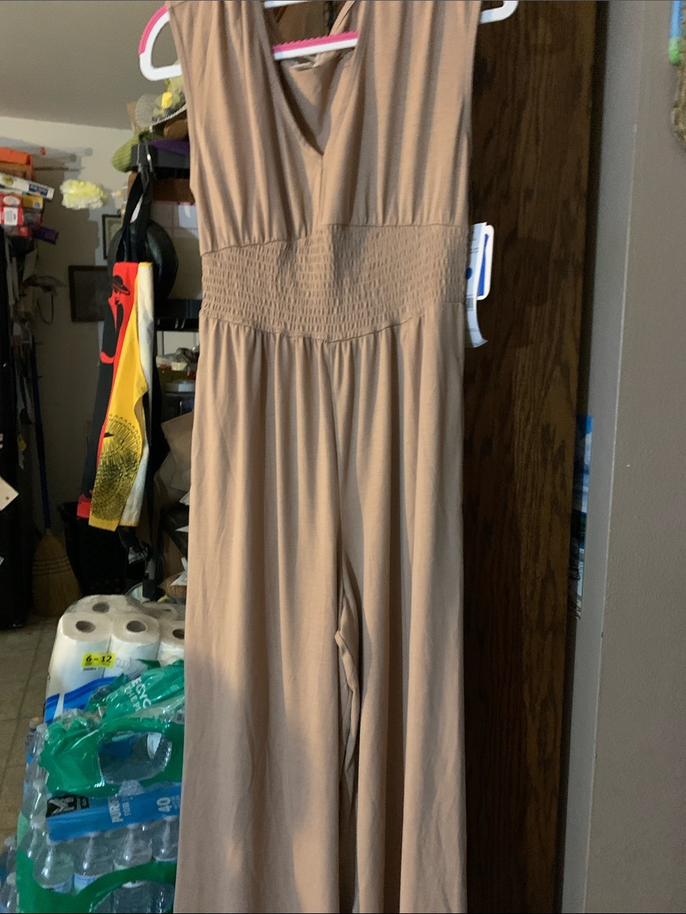 Women taupe sleeveless wide leg jumpsuit with V-neck ruched waistband.